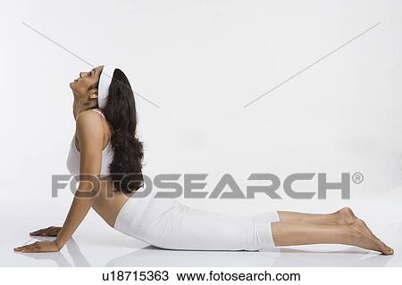 Woman doing Bhujangasana (Cobra Pose) View Large Photo Image Stock Image - Woman doing Bhujangasana (Cobra Pose). Fotosearch