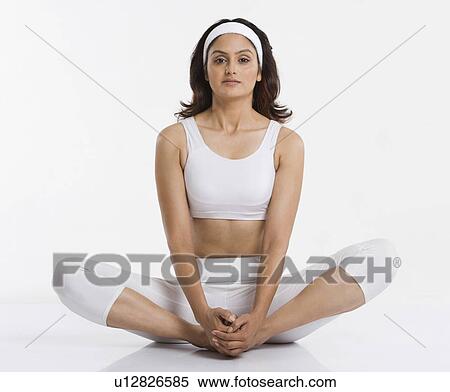 Stock Photography - Woman doing butterfly pose. Fotosearch