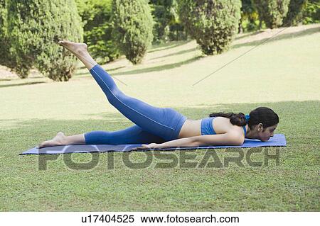 Stock Photography - Woman doing Dhanurasana (Bow Pose). Fotosearch