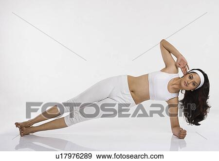 Stock Photo - Woman doing Vasisthasana (Side Plank Pose). Fotosearch