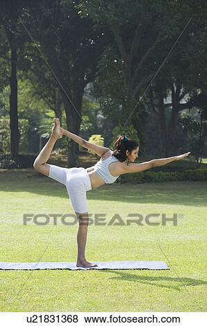 Woman doing Veerasana (Warrior Pose) View Large Photo Image Stock Photo - Woman doing Veerasana (Warrior Pose). Fotosearch