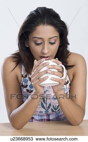 Woman drinking coffee View Large Photo Image Stock Image - Woman drinking coffee. Fotosearch