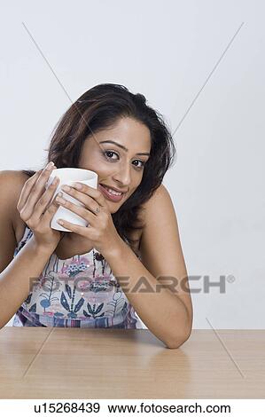 Stock Photo - Woman drinking coffee. Fotosearch