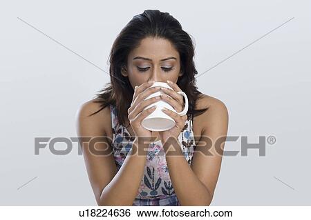 Woman drinking coffee View Large Photo Image Stock Photograph - Woman drinking coffee. Fotosearch