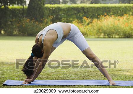 Stock Photo - Woman exercising. Fotosearch