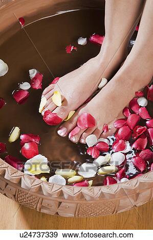 Stock Photo - Woman getting a pedicure treatment. Fotosearch