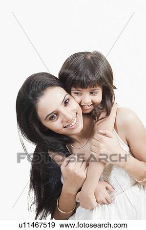 Woman giving piggyback ride to her daughter View Large Photo Image Stock Photo - Woman giving piggyback ride to her daughter. Fotosearch