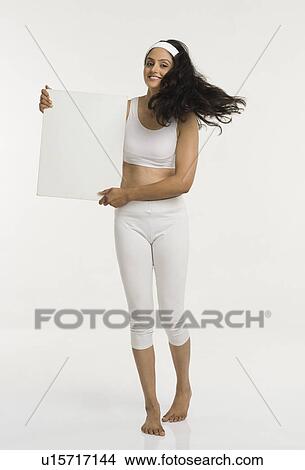 Picture - Woman holding a placard and smiling. Fotosearch