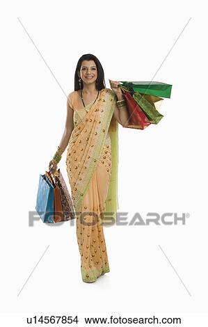 Woman holding shopping bags View Large Photo Image Picture - Woman holding shopping bags. Fotosearch
