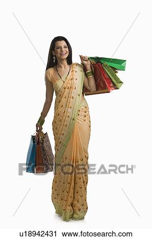 Woman holding shopping bags View Large Photo Image Stock Image - Woman holding shopping bags. Fotosearch