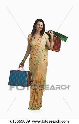 Woman holding shopping bags View Large Photo Image Stock Photo - Woman holding shopping bags. Fotosearch
