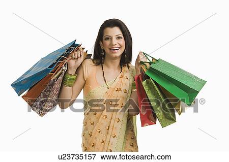 Woman holding shopping bags View Large Photo Image Stock Photo - Woman holding shopping bags. Fotosearch