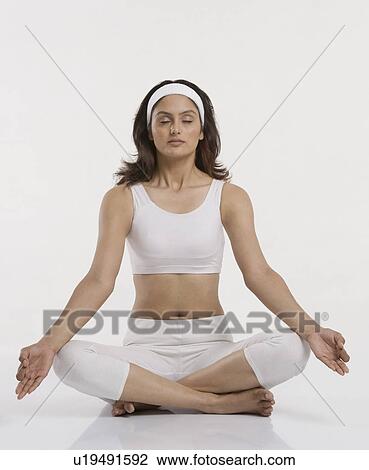 Woman practicing yoga View Large Photo Image Stock Image - Woman practicing yoga. Fotosearch