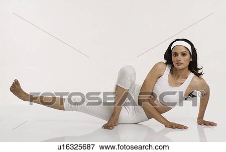 Woman practicing yoga View Large Photo Image Stock Photo - Woman practicing yoga. Fotosearch