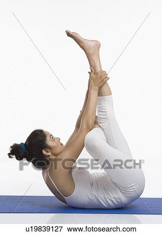 Woman practicing yoga View Large Photo Image Stock Photo - Woman practicing yoga. Fotosearch