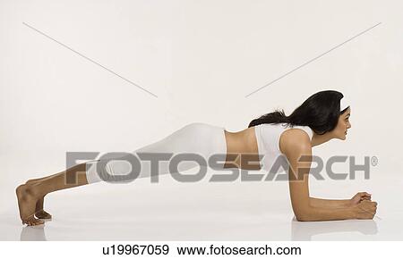 Stock Photo - Woman practicing yoga. Fotosearch