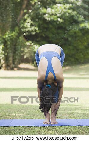Woman practicing yoga View Large Photo Image Stock Photography - Woman practicing yoga. Fotosearch