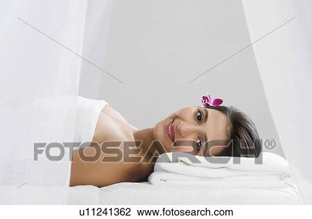 Stock Image - Woman receiving spa treatment. Fotosearch