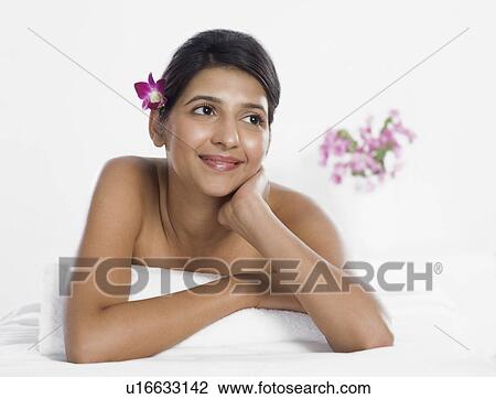 Stock Image - Woman receiving spa treatment. Fotosearch