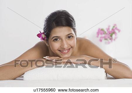 Stock Image - Woman receiving spa treatment. Fotosearch