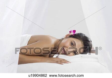 Stock Image - Woman receiving spa treatment. Fotosearch