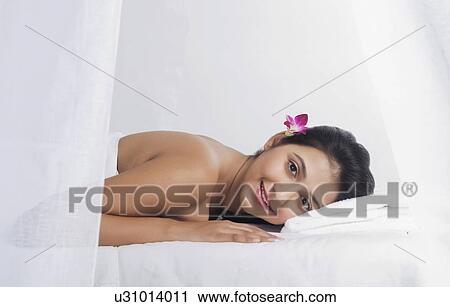 Stock Image - Woman receiving spa treatment. Fotosearch