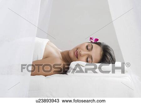 Woman receiving spa treatment with her eyes closed View Large Photo Image Stock Image - Woman receiving spa treatment with her eyes closed. Fotosearch