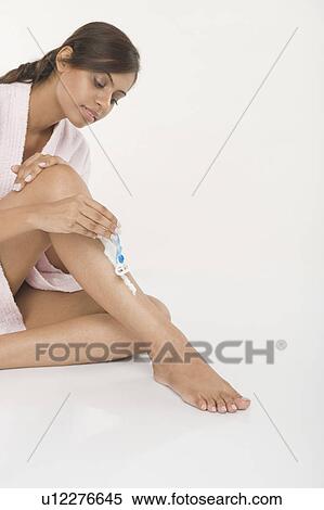 Woman shaving her leg View Large Photo Image Stock Photography - Woman shaving her leg. Fotosearch