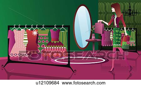 Woman shopping clothes in a clothing store View Large Photo Image Picture - Woman shopping clothes in a clothing store. Fotosearch