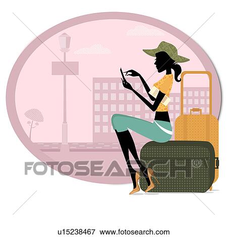 Stock Photo - Woman sitting with her luggage and using a mobile phone. Fotosearch