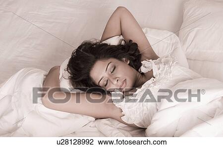 Woman sleeping in the bed View Large Photo Image Stock Image - Woman sleeping in the bed. Fotosearch