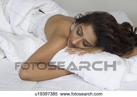 Woman sleeping in the bed View Large Photo Image Stock Photography - Woman sleeping in the bed. Fotosearch