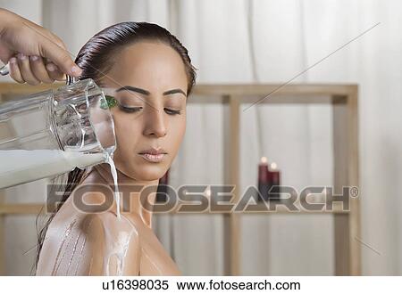 Woman taking a milk bath in a health spa View Large Photo Image Stock Photography - Woman taking a milk bath in a health spa. Fotosearch