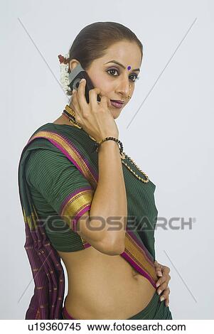 Stock Photography - Woman talking on a mobile phone. Fotosearch