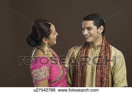Stock Photograph - Woman talking to her son and smiling. Fotosearch