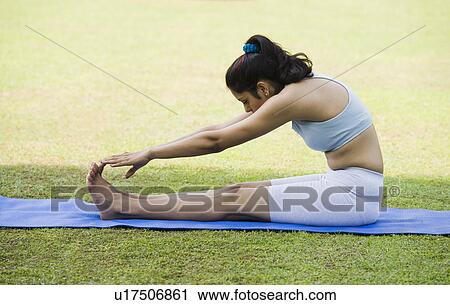 Woman touching her toes View Large Photo Image Stock Image - Woman touching her toes. Fotosearch