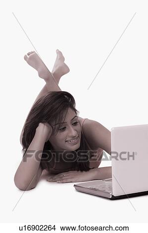 Woman using a laptop View Large Photo Image Picture - Woman using a laptop. Fotosearch
