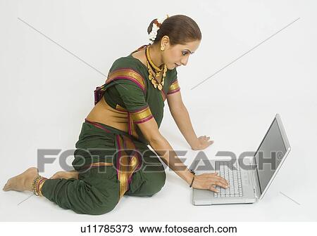 Woman using a laptop View Large Photo Image Stock Image - Woman using a laptop. Fotosearch