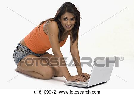 Woman using a laptop View Large Photo Image Stock Image - Woman using a laptop. Fotosearch