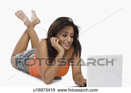 Stock Photo - Woman using a laptop. Fotosearch