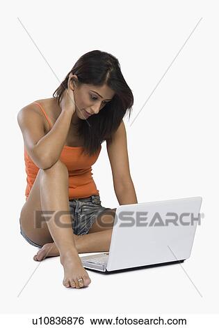 Stock Photograph - Woman using a laptop. Fotosearch