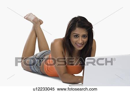 Stock Photography - Woman using a laptop. Fotosearch