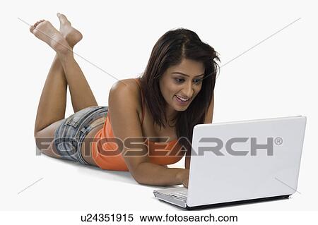 Woman using a laptop View Large Photo Image Stock Photography - Woman using a laptop. Fotosearch