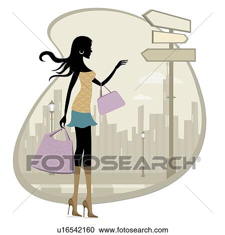 Stock Image - Woman waiting for a taxi at the roadside. Fotosearch