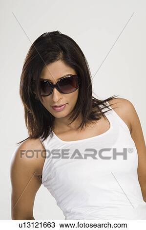 Stock Image - Woman wearing sunglasses. Fotosearch