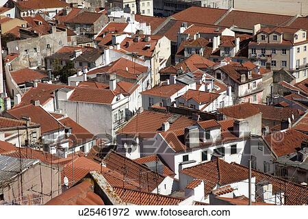 Stock Image - Aerial view of village rooftops. Fotosearch