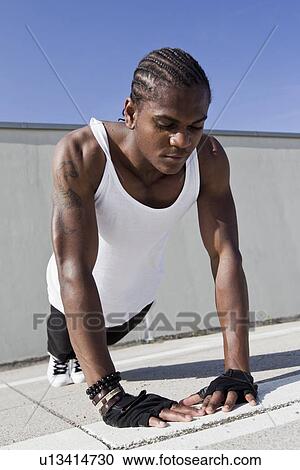 Athlete doing push ups on sidewalk View Large Photo Image Stock Image - Athlete doing push ups on sidewalk. Fotosearch