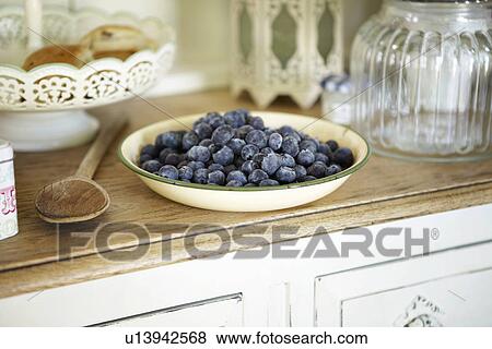 Bowl of blueberries on kitchen counter View Large Photo Image Stock Photo - Bowl of blueberries on kitchen counter. Fotosearch