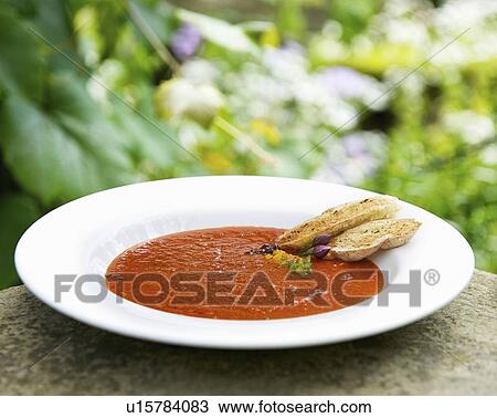 Stock Image - Bowl of tomato and basil soup. Fotosearch