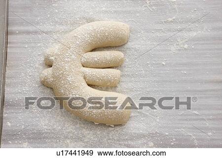Bread dough shaped in Euro symbol View Large Photo Image Stock Photo - Bread dough shaped in Euro symbol. Fotosearch